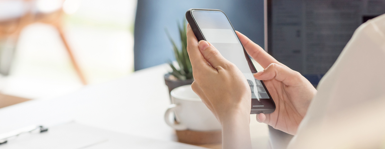 Woman holding a cell phone.